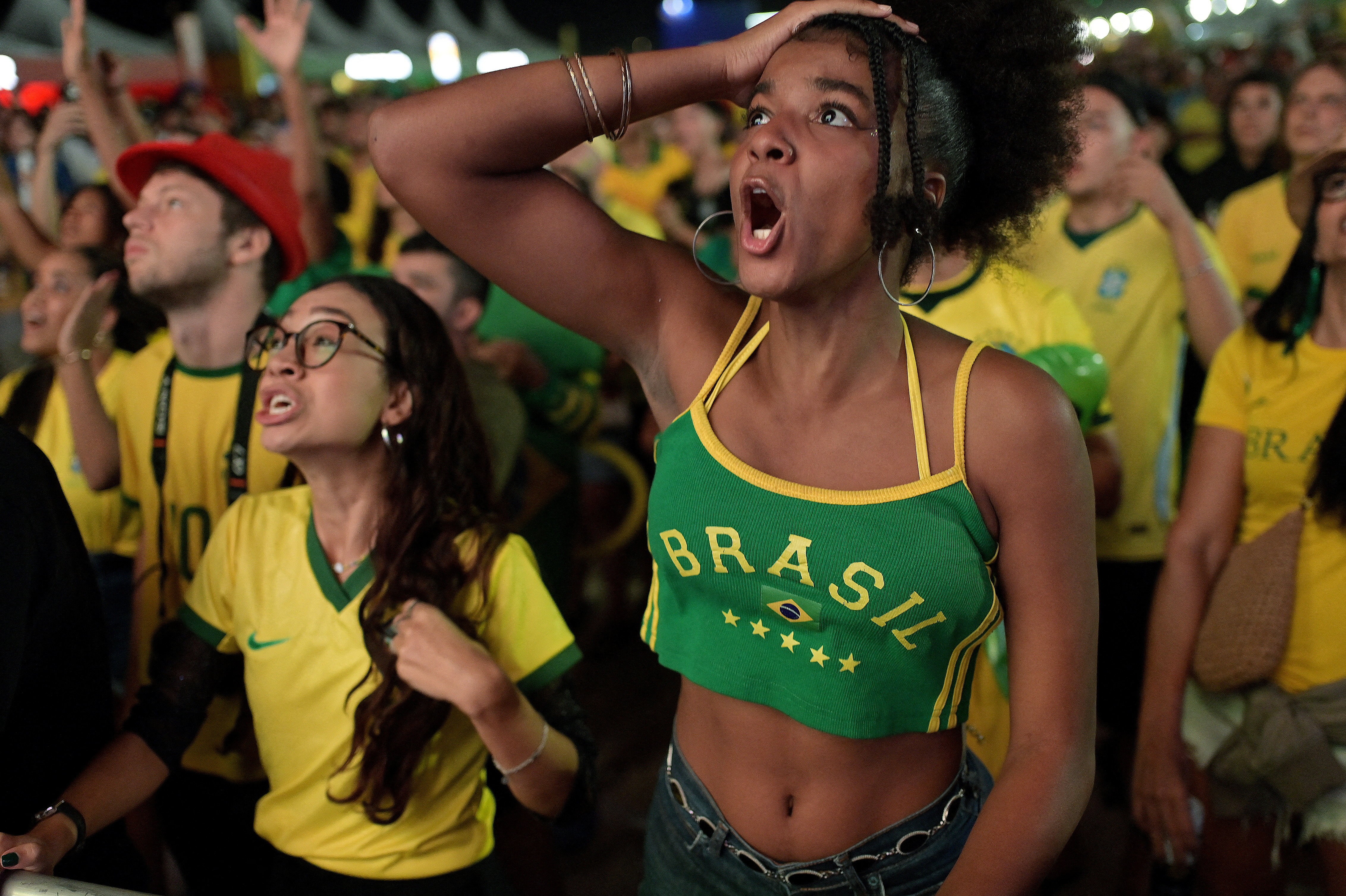 Team Brazil fans react during a watch party.