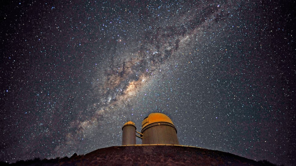 The Milky Way glitters in the night sky above a space observatory in Chile.