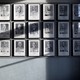 A wall of pictures of former Auschwitz prisoners