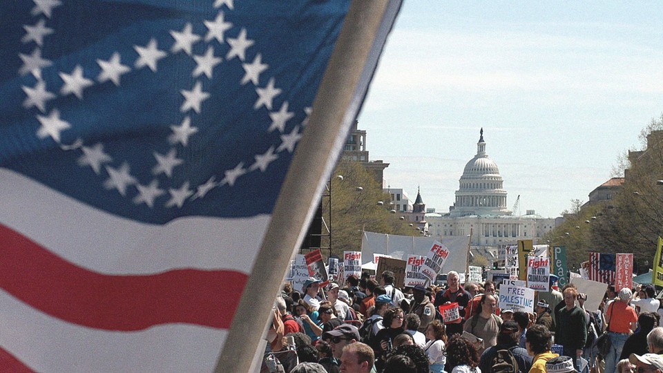 Anti-war protesters gather on 12 April 2003 at Freedom Plaza in Washington, DC.