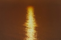 the sun setting on the water