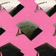 An illustration featuring graduation caps that shade from black to white