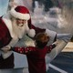 Santa Claus, entrapped in a giant snow globe, reaches out his hands towards a little boy, who also has his arms outstretched.
