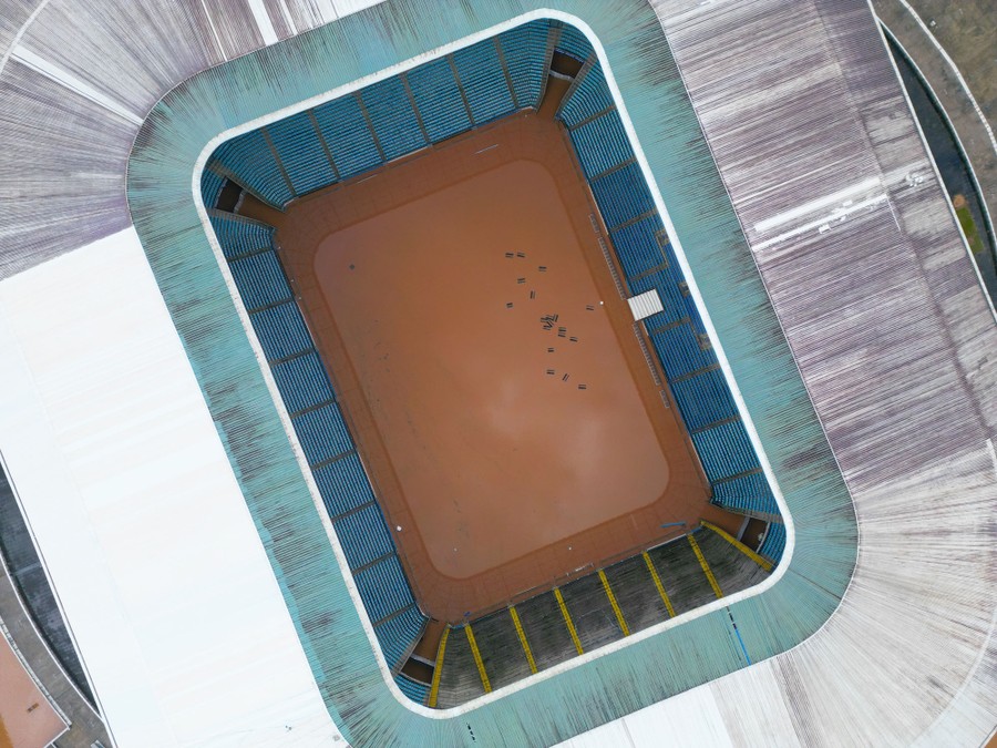 An aerial view of a flooded soccer stadium