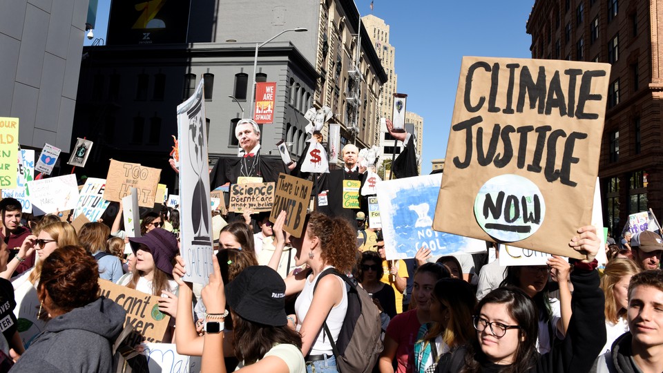 Young people protest outside the San Francisco Federal Building during a Climate Strike march.