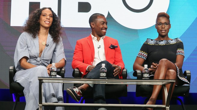 Melina Matsoukas, Prentice Penny and Issa Rae on stage at a panel.