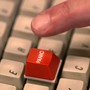 red panic button on a white keyboard