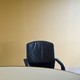 Photo of two empty chairs at a boardroom table