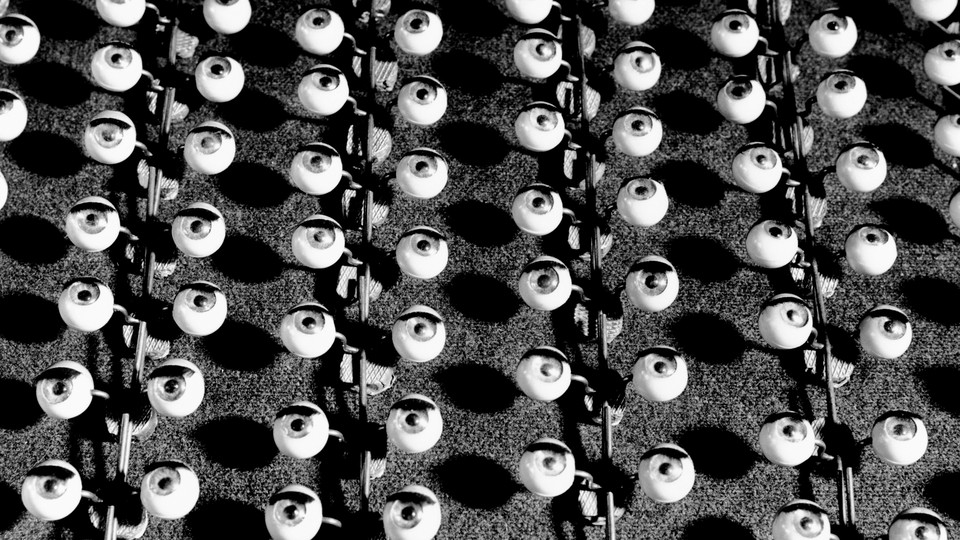 Black-and-white photo showing a mass-produced batch of wide-open eyeballs