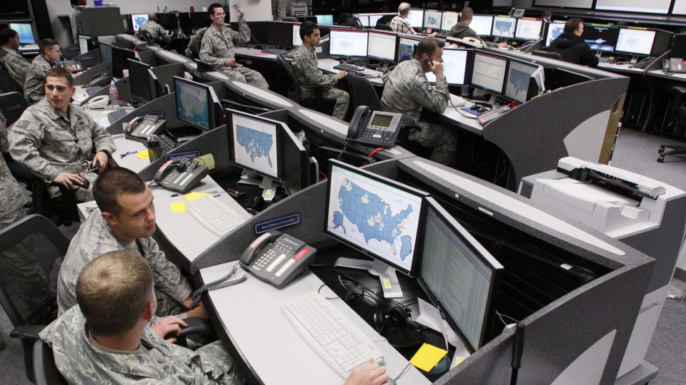 Personnel work at the Air Force Space Command Network Operations and Security Center at Peterson Air Force Base in Colorado.