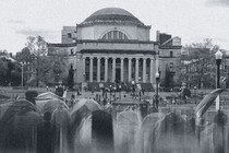 A black-and-white image of protester encampments on the Columbia University lawn.