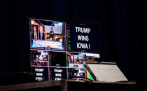 Screens prepared to broadcast at a caucus night watch party with former US President Donald Trump in Des Moines, Iowa
