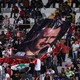 Syrian football supporters display a portrait of Syrian President Bashar al-Assad during the 2018 World Cup qualifying football match between South Korea and Syria.