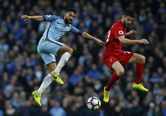 Liverpool's Adam Lallana in action with Manchester City's Gael Clichy.