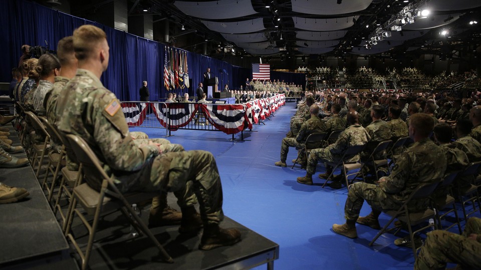 Members of the U.S. military listen as President Trump announces his strategy for the war in Afghanistan.