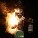 A photo of a burning effigy of Guy Fawkes.