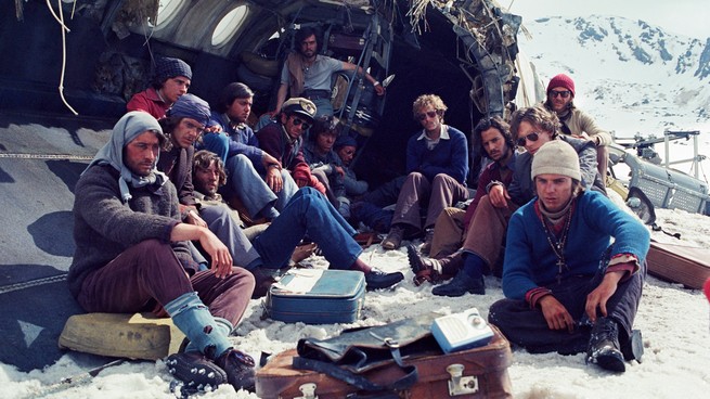 The Andes plane crash survivors sitting in the snow