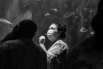 visitors in face masks at the Aquarium of the Pacific in July 2021