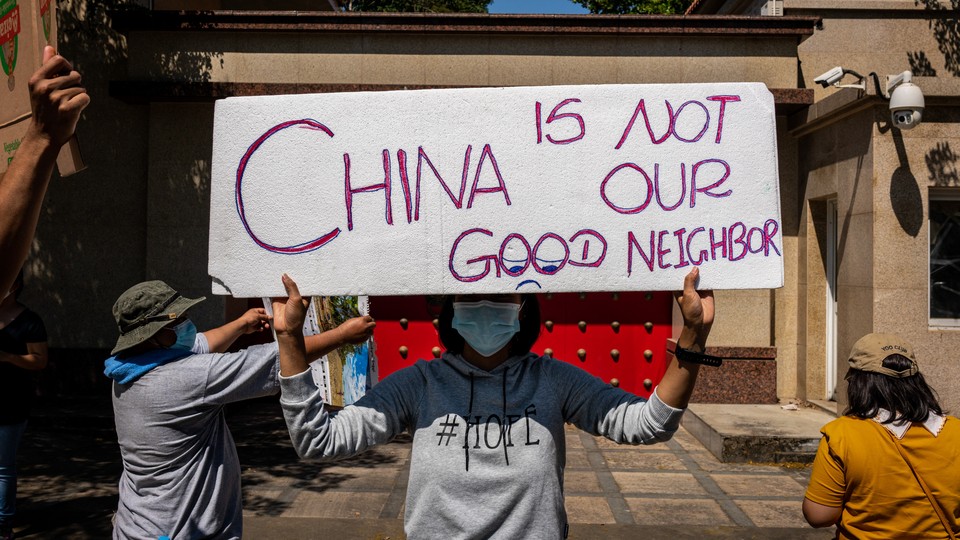 Protesters gather in front of the Chinese Embassy on February 11, 2021, in Yangon, Myanmar.