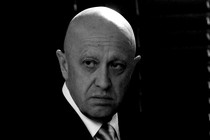 Black-and-white photo of Yevgeny Prigozhin, a bald man in a suit