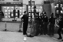 Police near a vigil for Aaron Bushnell
