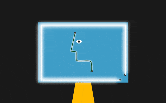 A computer monitor has a glowing light on its edges and a blinking face in its middle.
