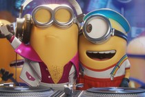 A Minion with chest hair and a lighter, next to a Minion wearing rainbow suspenders