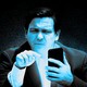 Ron DeSantis staring at a phone