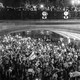 A black-and-white photo of protesters crowded under and on top of a bridge in Georgia.