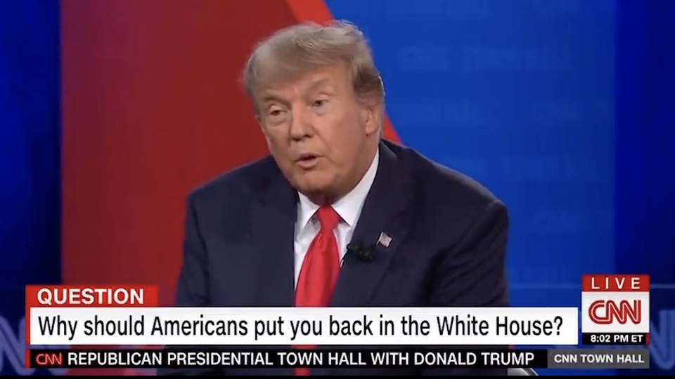 A still of Donald Trump at the CNN town hall with a chyron that reads "Question: Why should Americans put you back in the White House?"