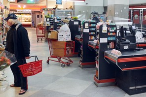 a man in a grocery store in the early morning