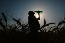 A wheat farmer in India drinks water during the April heat wave.