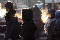 People in winter clothing with visible breath