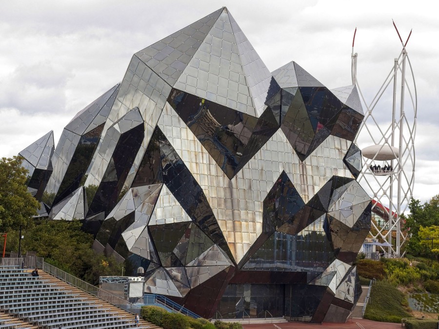 A multifaceted facade of a large building, shaped like a giant crystal