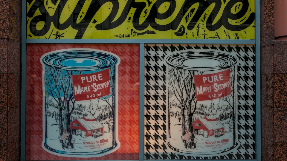 A painting featuring cans of pure maple syrup is found on a store wall on June 28, 2015 in Montreal, Quebec, Canada.