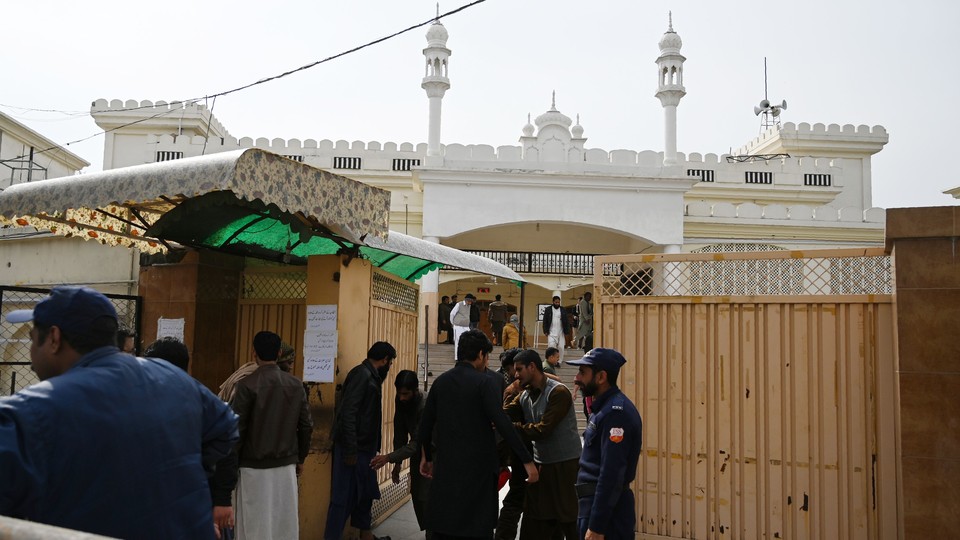 Men arrive for Friday prayers at an Islamabad mosque affiliated with Jamaat-ud-Dawa days after it was banned.