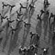 A black and white picture of soldiers running.