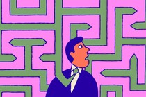 A man in a tie standing in the middle of a maze