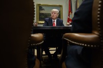 President Donald Trump listens during a meeting with county sheriffs in the Roosevelt Room of the White House.