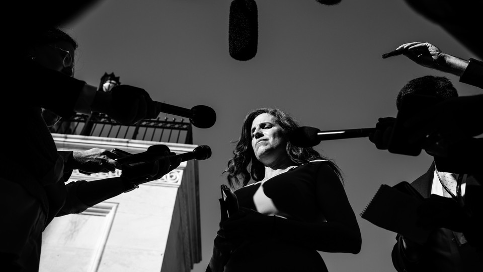 Reporters surround Representative Nancy Mace outside the Capitol Building