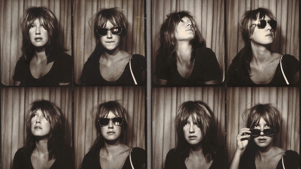 A series of black-and-white images of a woman, sometimes wearing sunglasses, taken in a photo booth