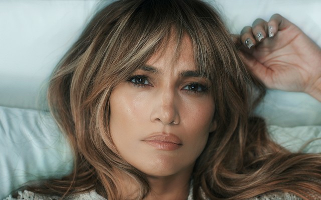 Close-up shot of Jennifer Lopez lying down and looking serious