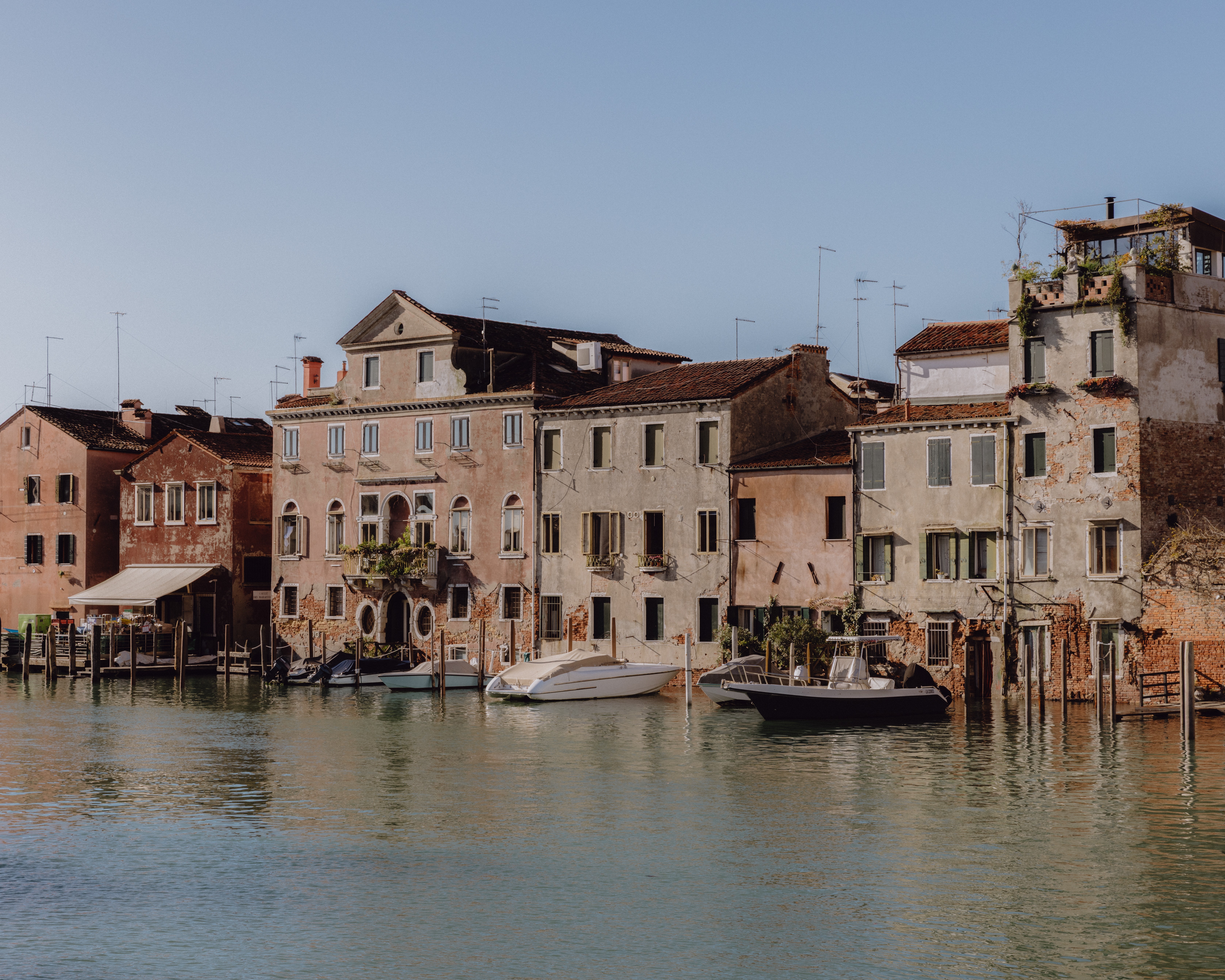 Venice canal lined with stucco buildings