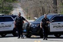 A photo of a police barricade outside the suspected leaker's home