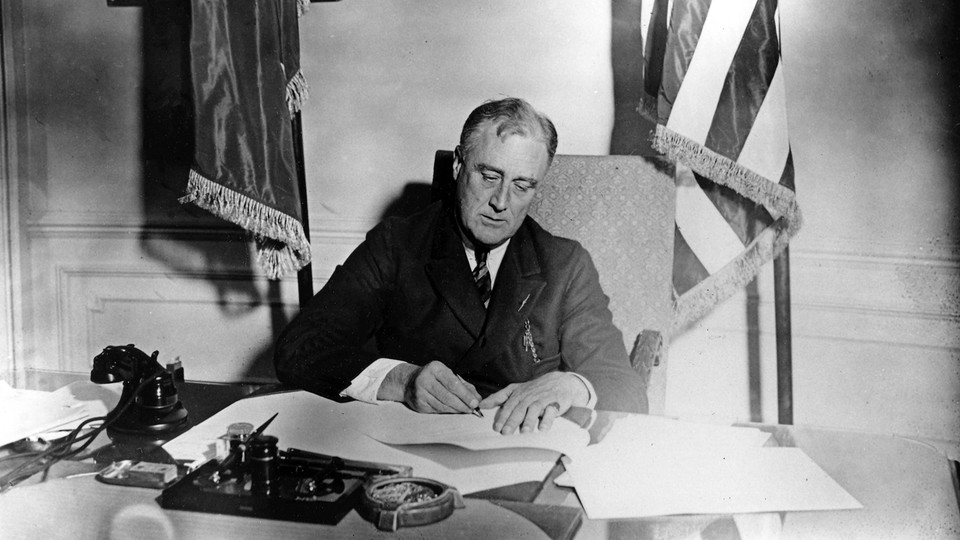 Franklin D. Roosevelt signs the Emergency Banking Act