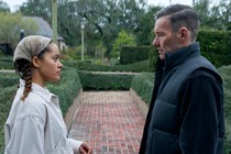 Quintessa Swindell and Joel Edgerton stare at each other while standing in a garden, in "Master Gardener."