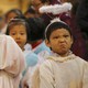 Children dressed as angels attend a Christmas mass at a Catholic church in Beijing.