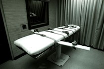 A photograph of a bed in an execution chamber.
