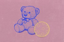 A teddy bear alone with a ball