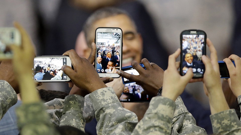 U.S. troops snapped photos of President Barack Obama after he delivered a speech in Seoul on April 26, 2014.